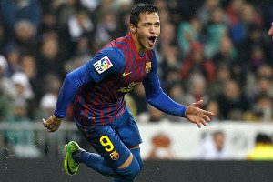 Barcelona's Alexis Sanchez celebrates his goal against Real Madrid during their Spanish first division soccer match, the "Clasico", at the Santiago Bernabeu stadium in Madrid, December 10, 2011. REUTERS/Juan Medina (SPAIN - Tags: SPORT SOCCER)