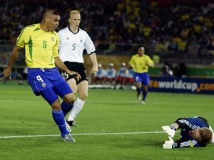 YOKOHAMA - JUNE 30: Ronaldo of Brazil beats Germany keeper Oliver Kahn to score the opening goal during the Germany v Brazil, World Cup Final match played at the International Stadium Yokohama in Yokohama, Japan on June 30, 2002. Brazil won 2-0. (Photo by David Cannon/Getty Images)